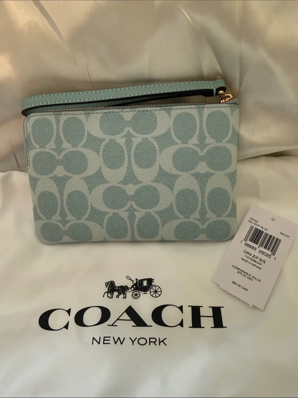 Coach wristlet featuring